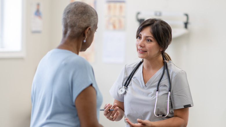doctor talking to patient