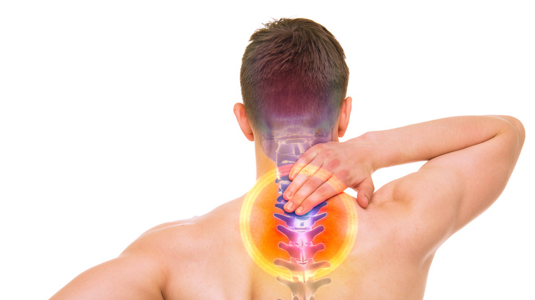 graphic of a male's spine, identifying spots of pain 