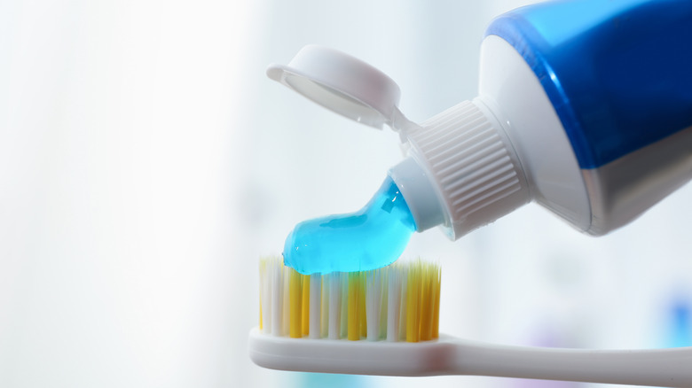 toothpaste on toothbrush