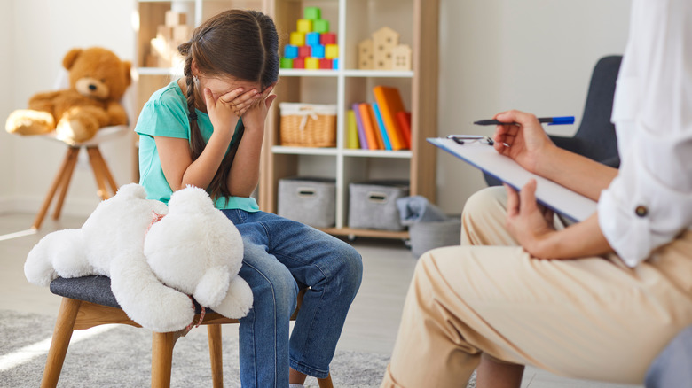 distressed child in counseling session