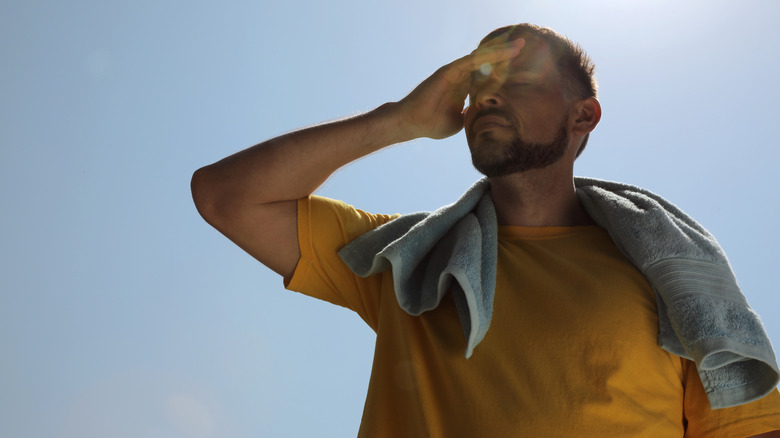 Man standing outside in the heat