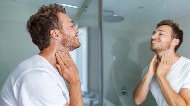 Man applying moisturizer after shaving