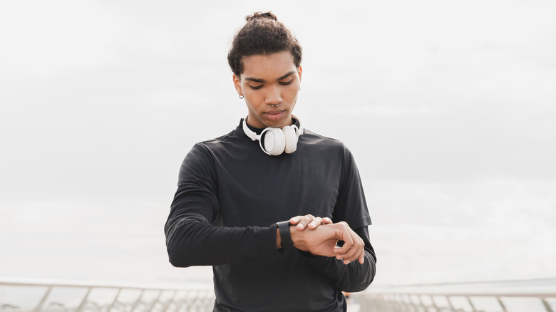 Young man checking heart rate