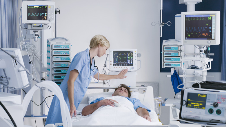 a doctor observes man in sleep study