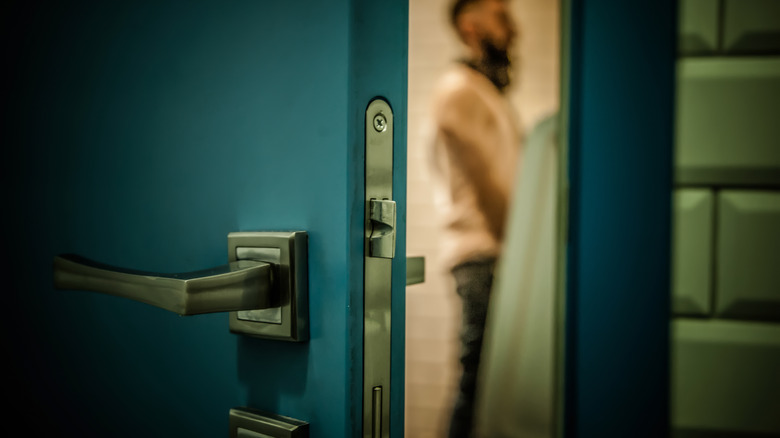 man using bathroom (blurred)