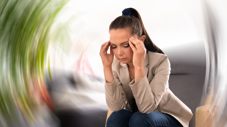 woman experiencing dizziness and disorientation