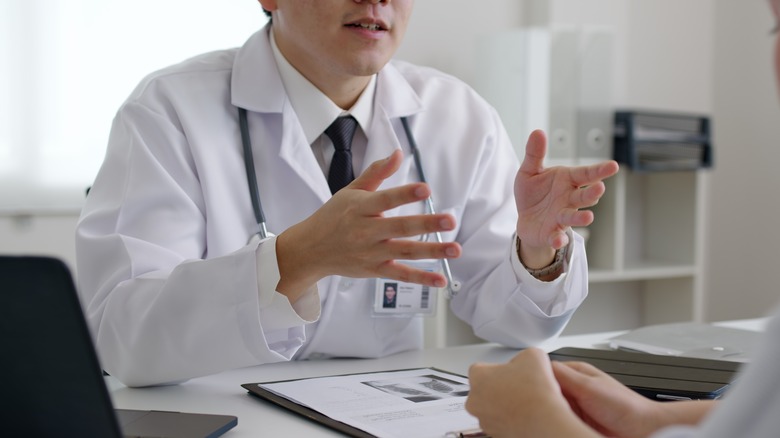 Doctor seeing Bell's palsy patient