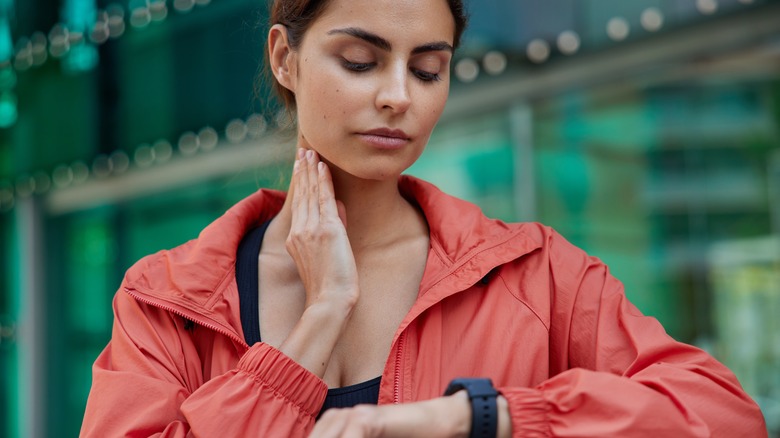 woman checking her pulse