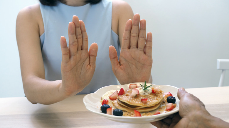 person refusing food