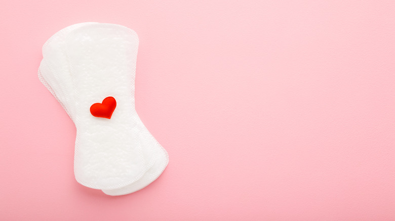 Menstrual pads on pink background