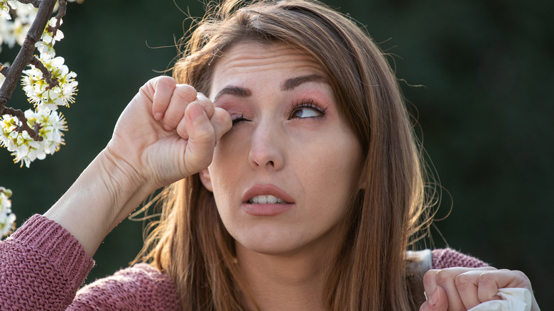 Woman rubbing her eyes