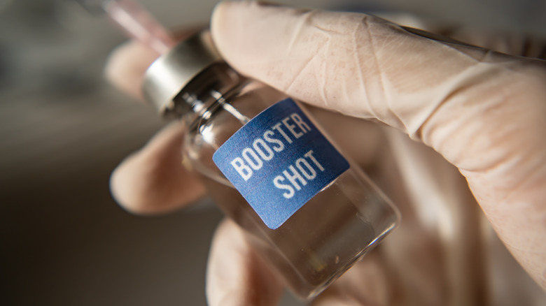 close up of glass container labeled 'Booster Shot' 