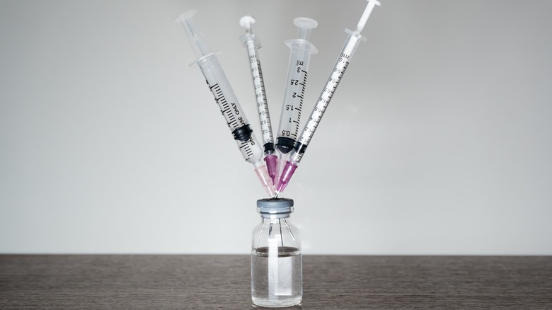 4 syringes in a vaccine vial 