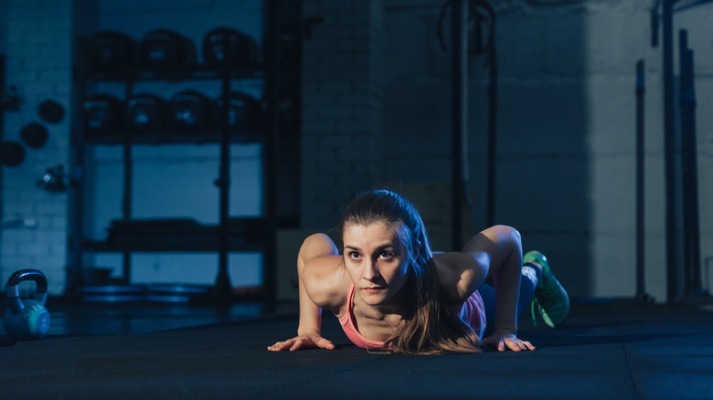 woman doing burpees