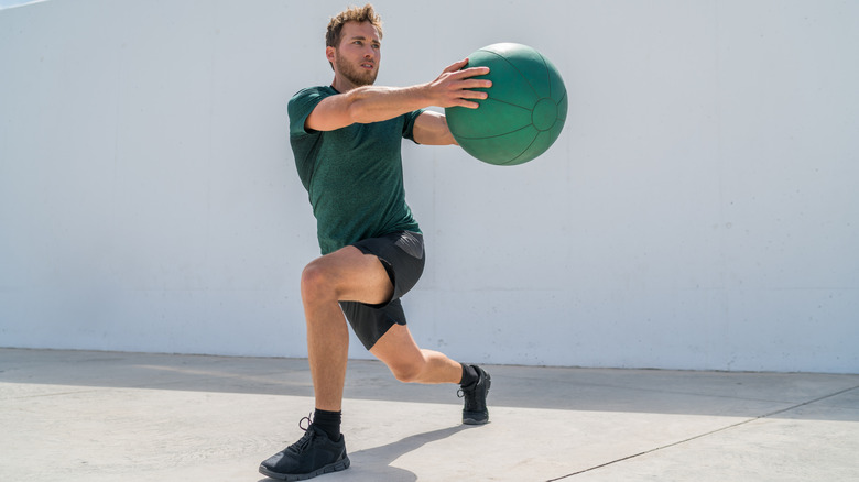 man doing twist lunge