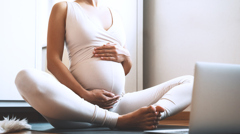 Close up of woman doing prenatal yoga