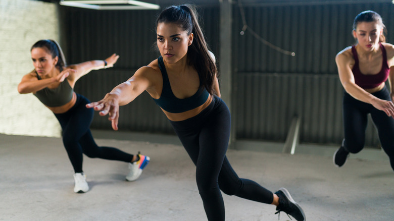 Women doing side skater exercise