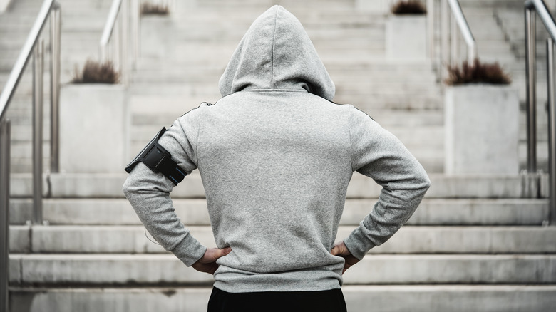 Man about to run up stairs