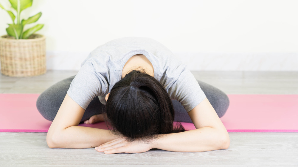 Woman exhausted doing yoga