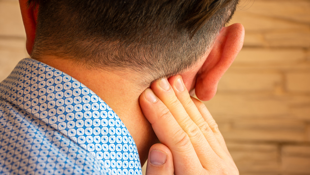 Back of man's head showing ear