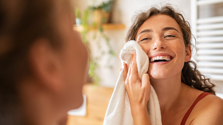 Woman drying her face