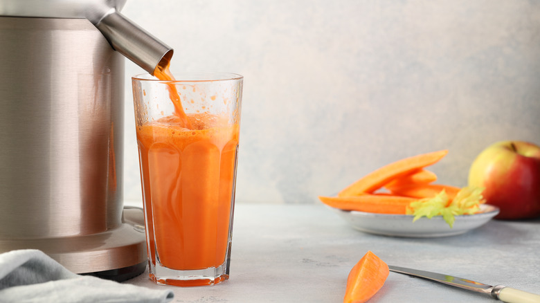 A juicer makes carrot juice