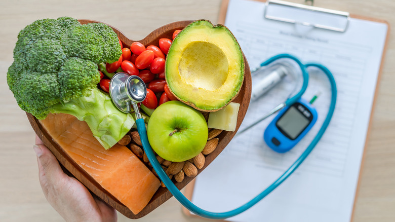 avocado and other healthy food with stethoscope