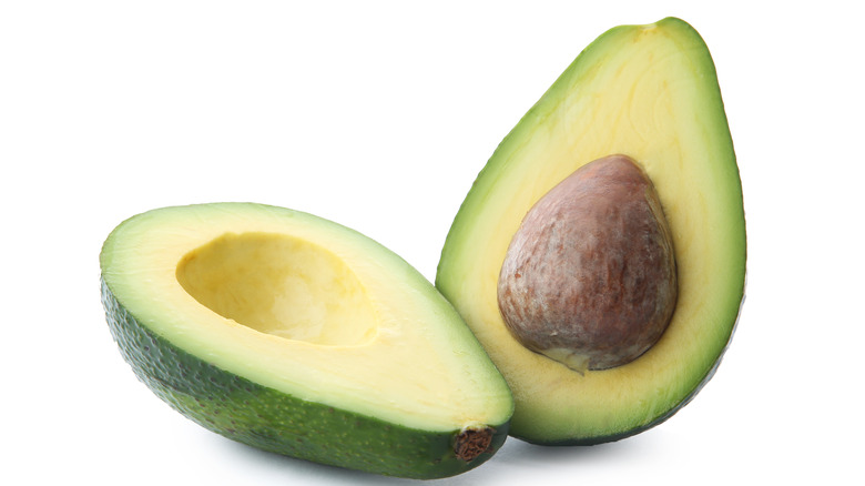 Avocado halved with pit