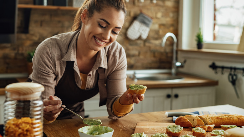 Woman eating avocado 