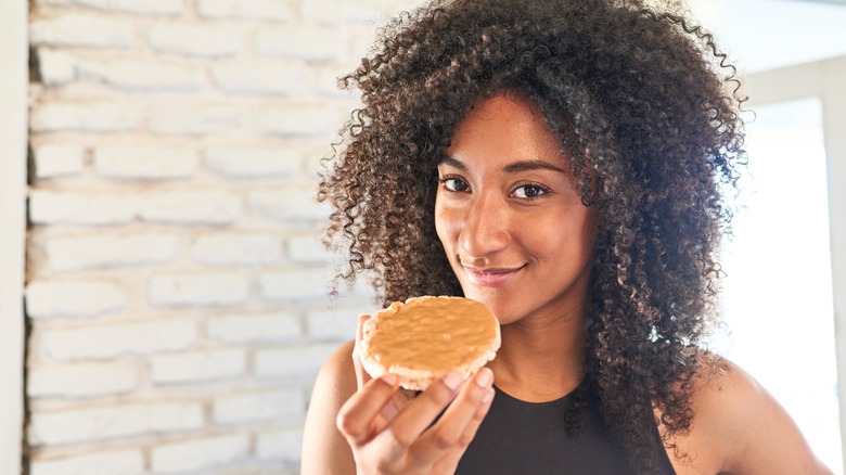 Woman eating peanut butter