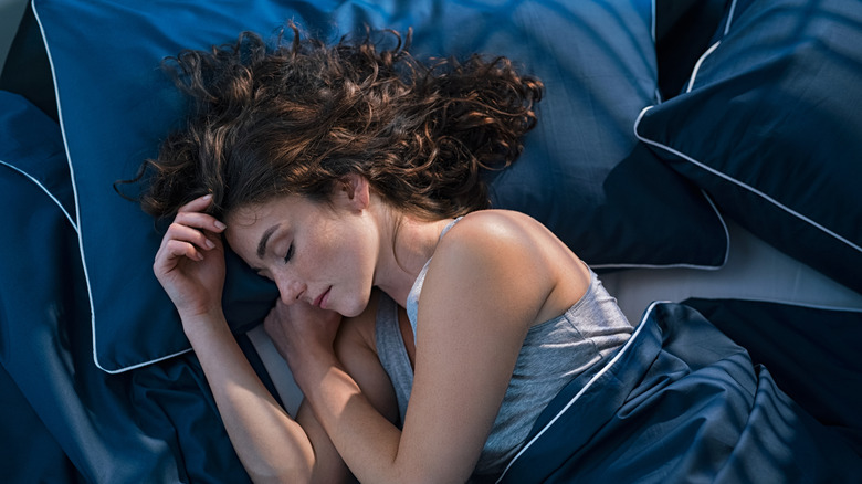 woman laying in bed asleep