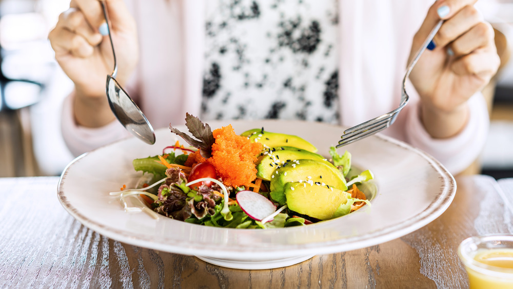 woman eating salad 