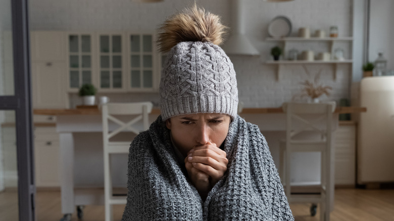 woman on sofa with blanket