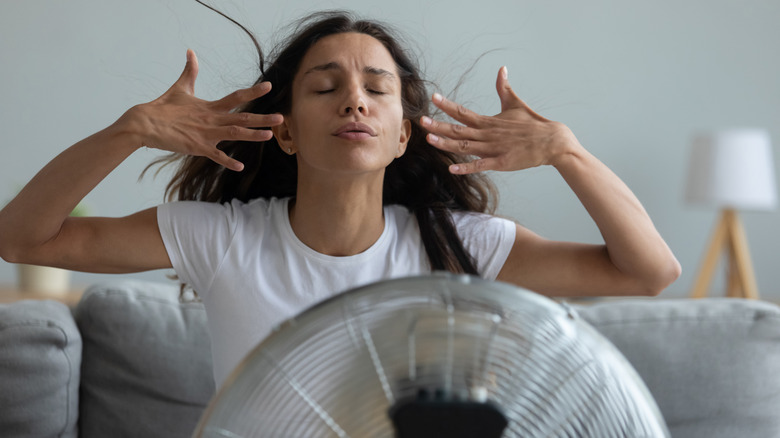 woman in front of fan
