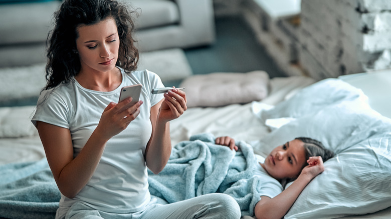 mom with fevered daughter