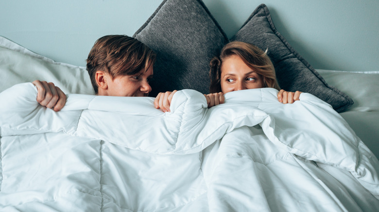 Couple in bed together