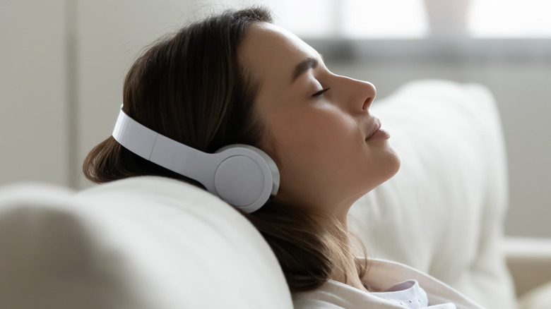 woman with headphones relaxing