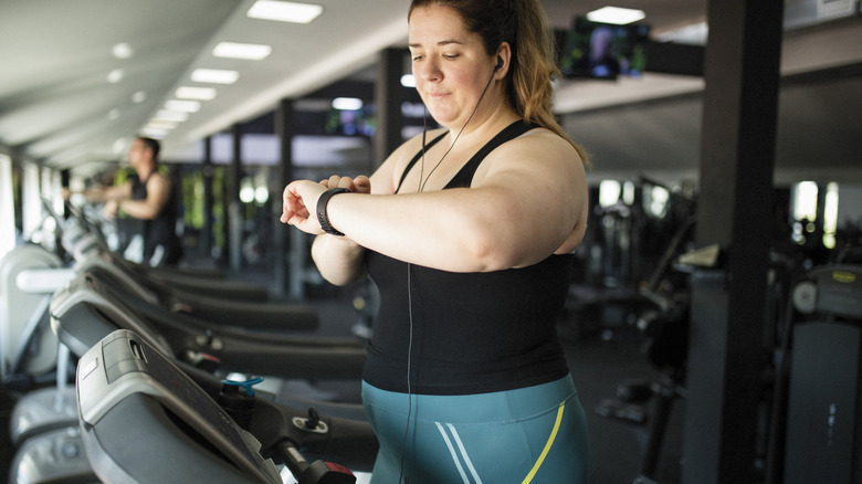 woman exercising at the gym on a treadmill