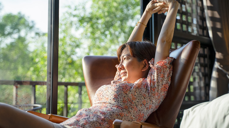 Woman stretching in chair