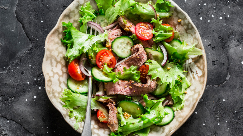 Pretty steak salad on plate