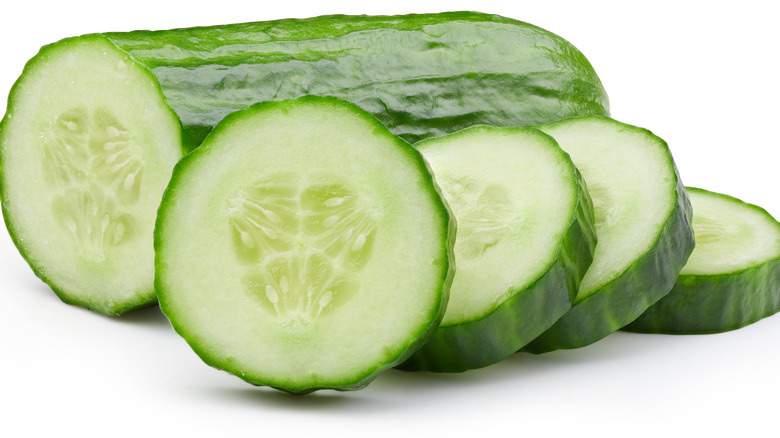 Cucumber slices leaning against cucumber