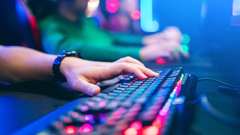 person on gaming keyboard