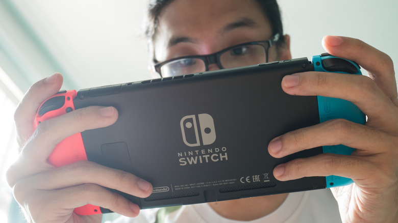 woman playing on Nintendo Switch