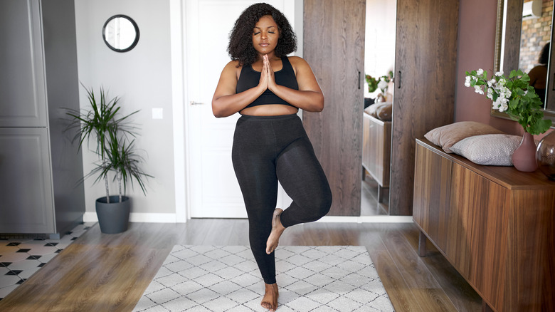 A woman practices yoga