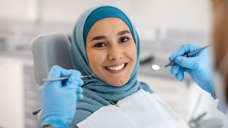 Smiling woman in dentist chair