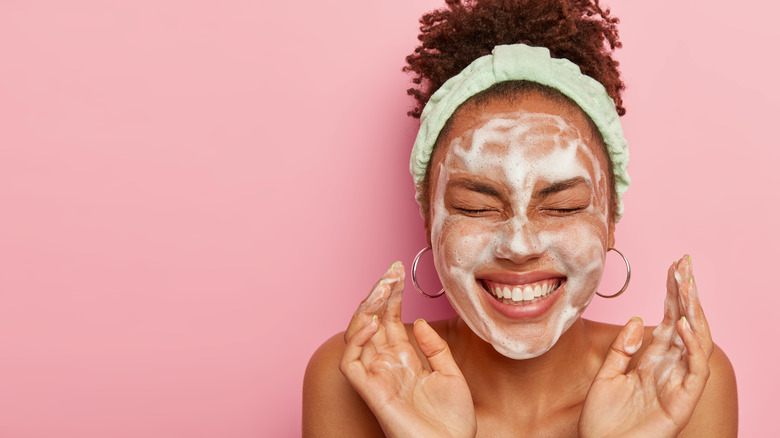 Woman washing her face