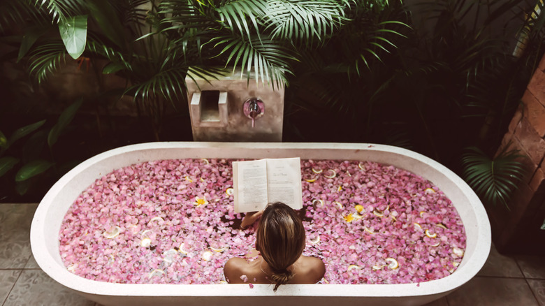 A woman takes a relaxing bath