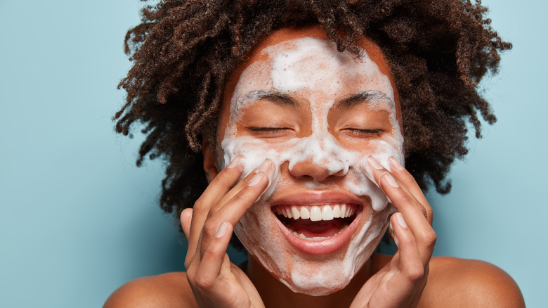 Woman washing her face