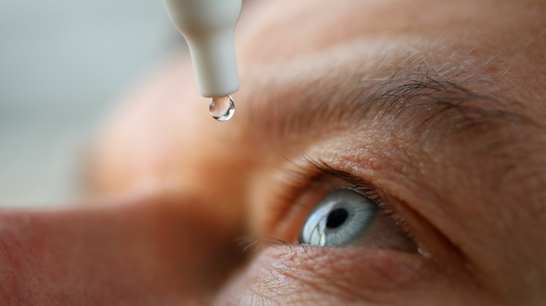 Man applying eyedrops