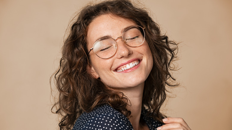 Happy woman wearing glasses